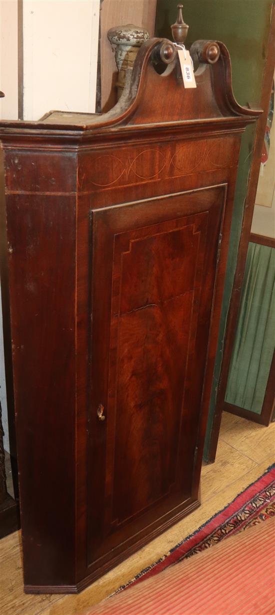 A George III inlaid mahogany hanging corner cabinet H.138cm